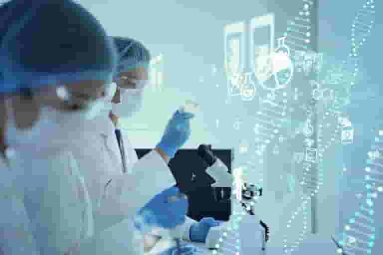 Two scientists in lab coats, masks, and hair covers work in a lab with microscopes and test tubes. Digital DNA strands and icons highlight biotechnology research for Brain Injury Education at the Nanaimo Brain Injury Society.